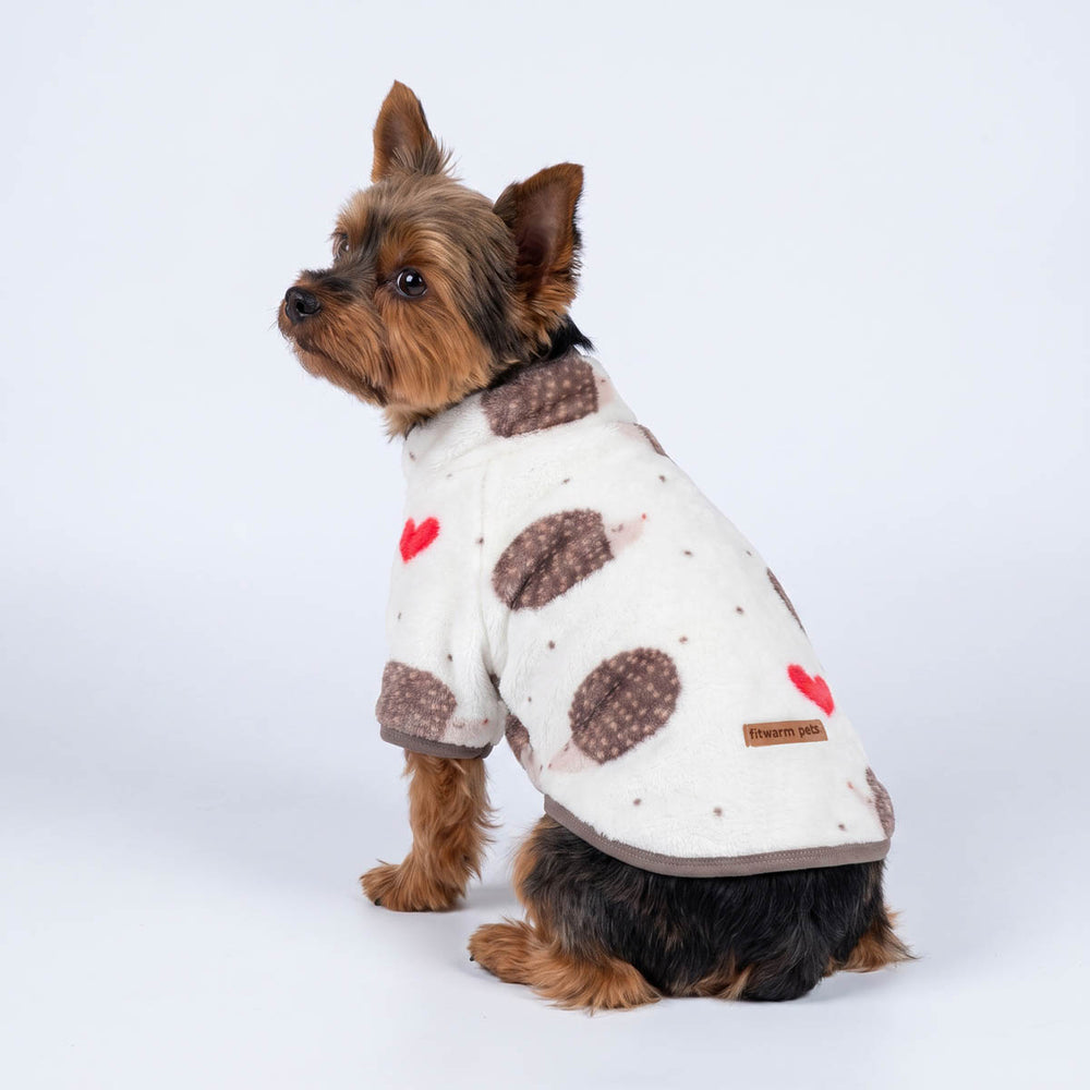 Yorkie looks back wih a hedgehog prints dog fleece coat