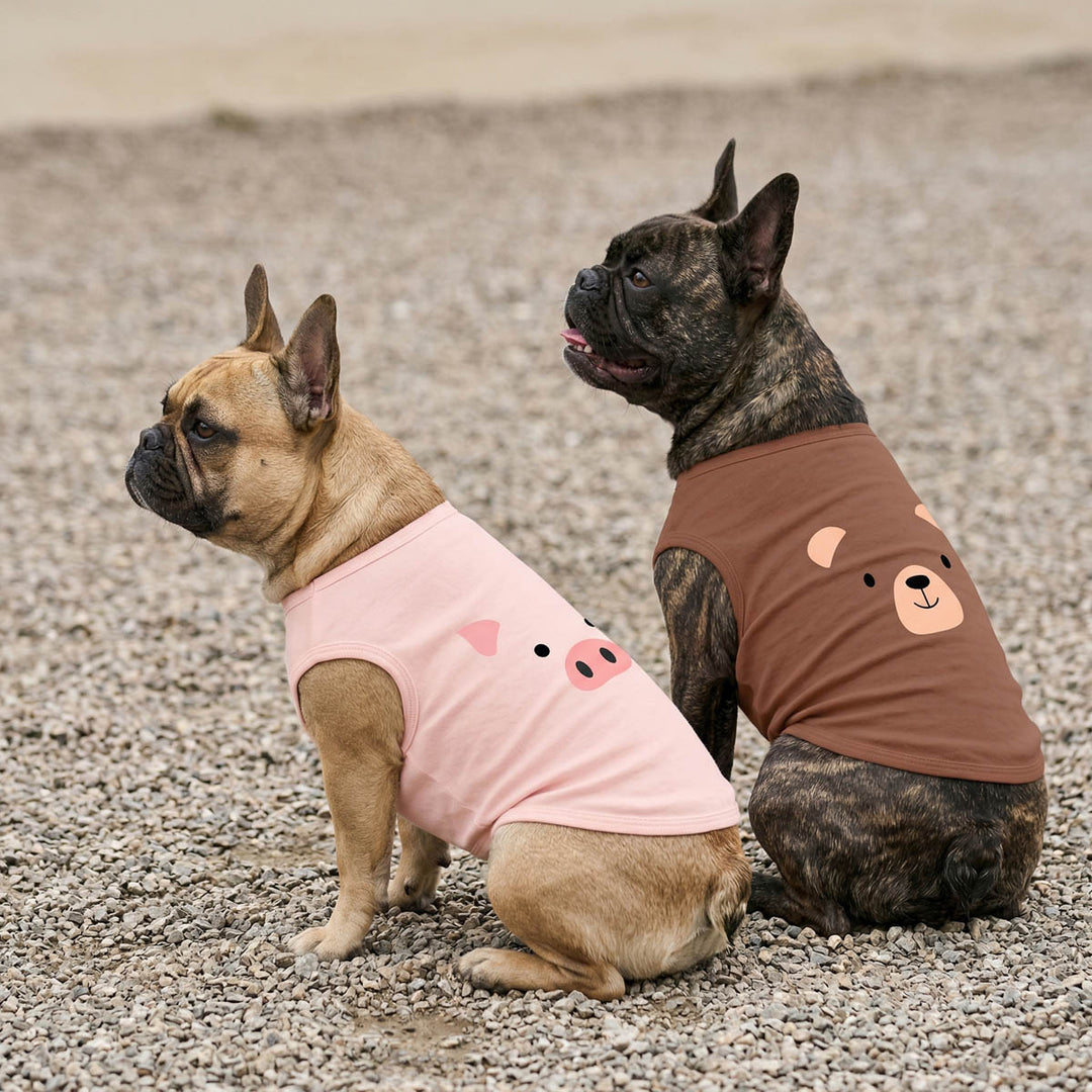 Two French Bulldog wearing dog tank tops with pig and bear face print