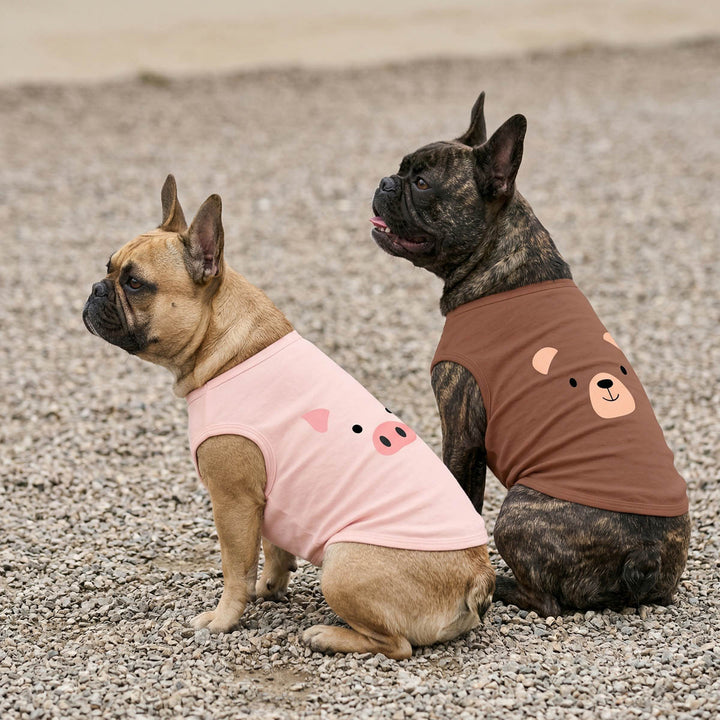 Two French Bulldog wearing dog tank tops with pig and bear face print