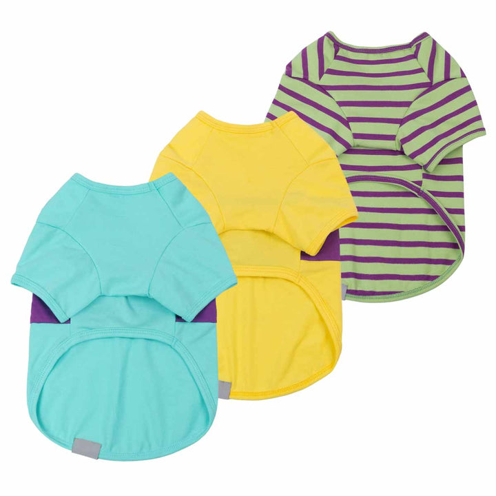 Three colorful pet shirts in green, yellow, and purple and green stripes and color block design on a white background