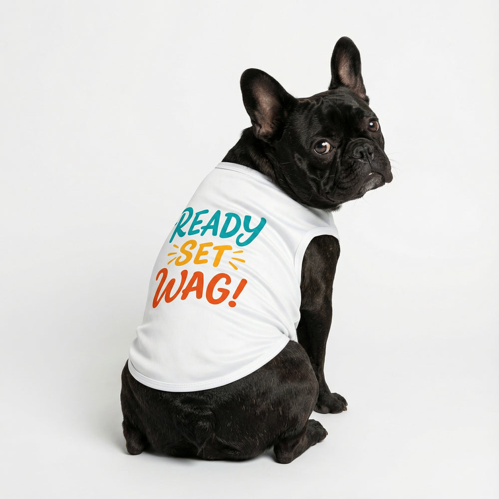 French bulldog sitting in white dog shirt with colorful "Ready Set Wag!' lettering