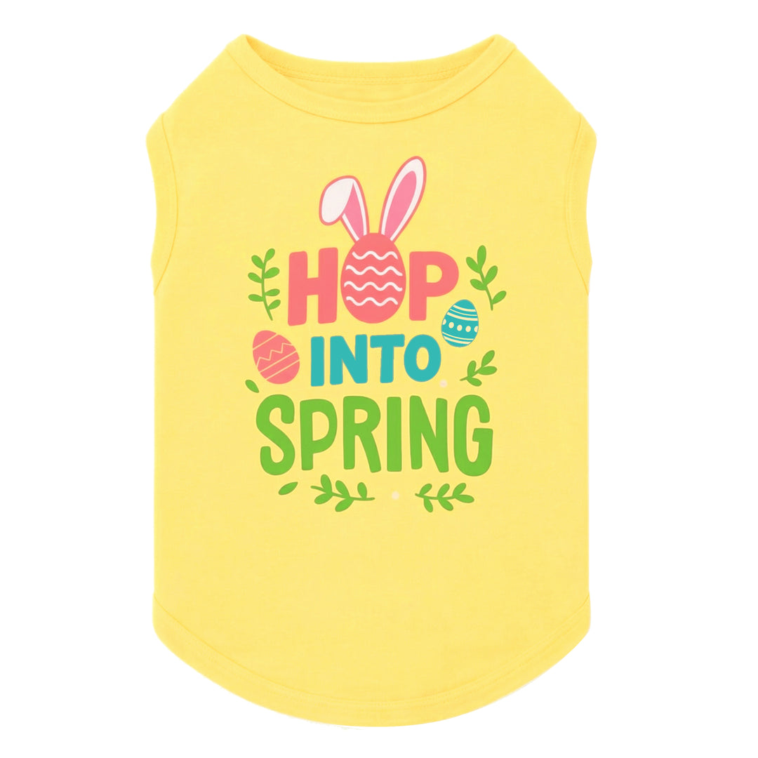 Bright yellow Easter dog shirt featuring “Hop Into Spring” text with bunny ears and colorful egg graphics