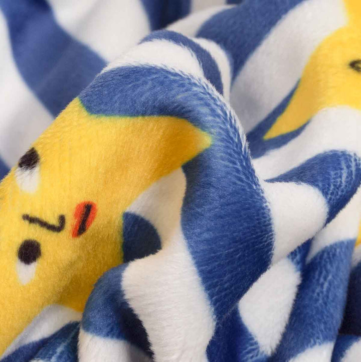 Close up of fuzzy fabric on dog pjs with star and striped prints
