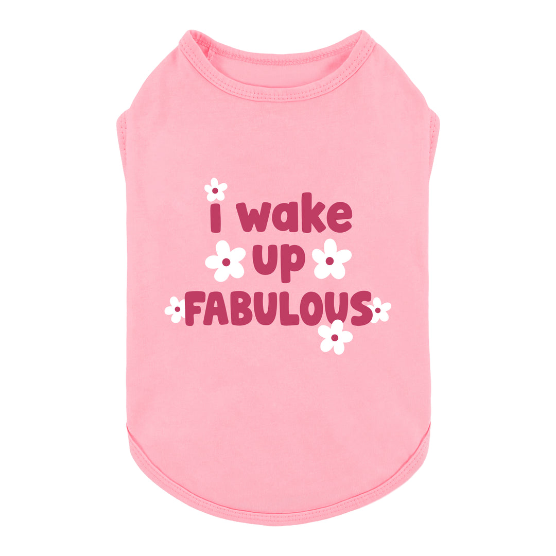 Pink sleeveless dog tshirt with the lettering 'I wake up FABULOUS' in dark pink and white flower graphics, shown on a plain white background