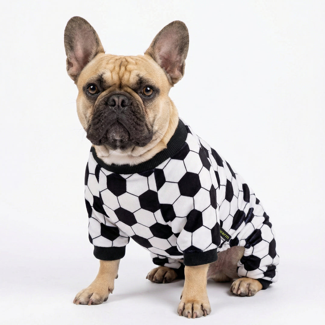 Soccer dog onesie worn by French bulldog featuring all-over ball print