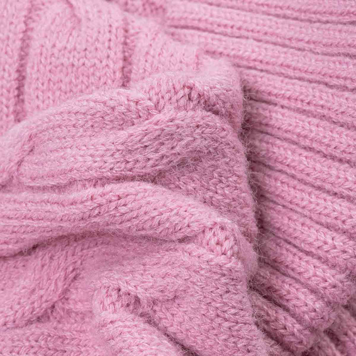Close-up of cozy chunky knit fabric of dog sweaters