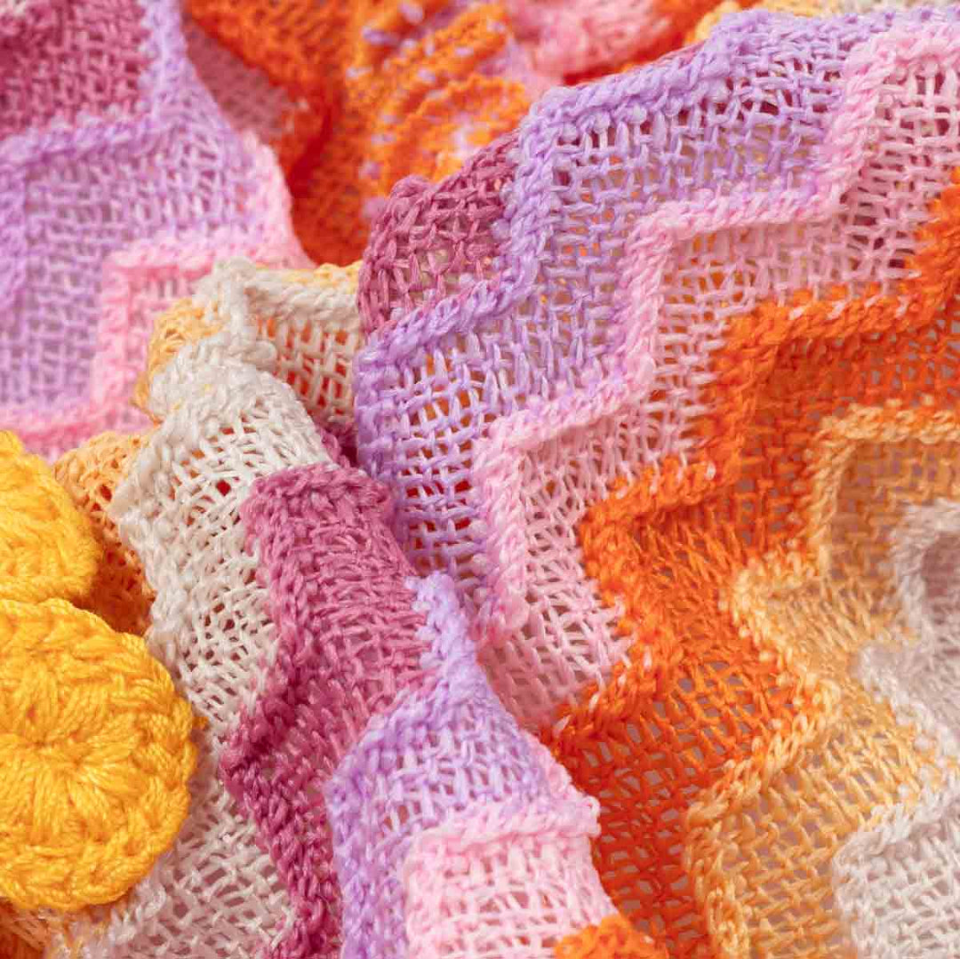 Close-up of colorful knitted fabric with wavy pattern