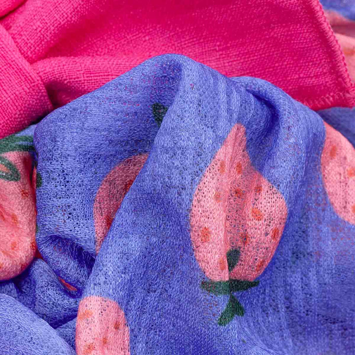 Close-up fabric of dog summer dress with strawberry and bow 