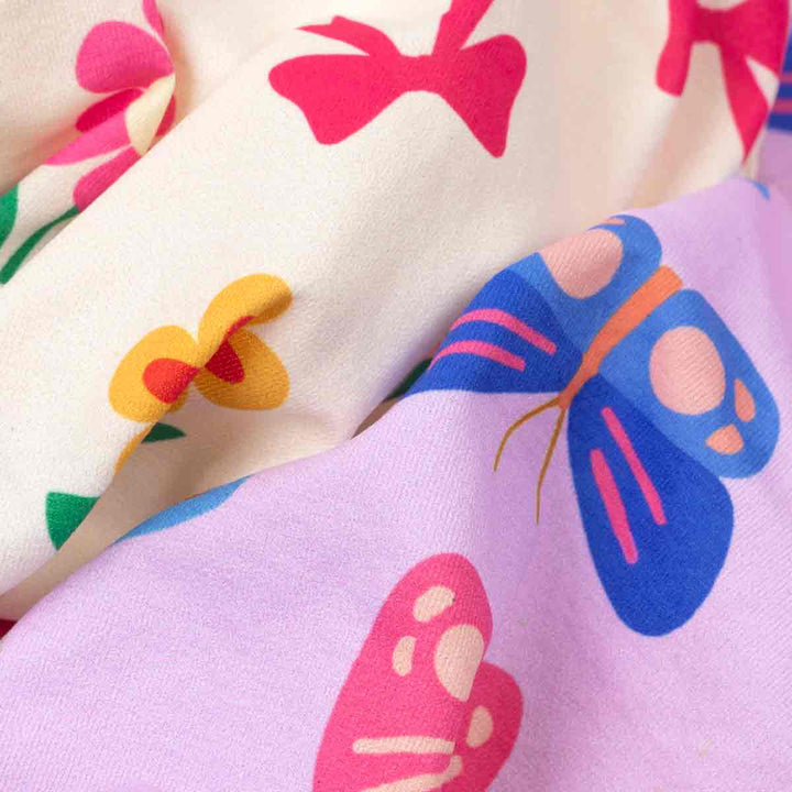 Close-up of colorful butterfly fabric pattern on a textured surface