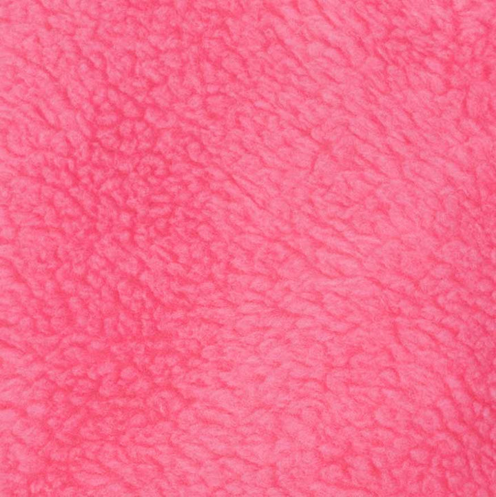 Pink sherpa fabric close-up showing fluffy texture used in dog sweater design.