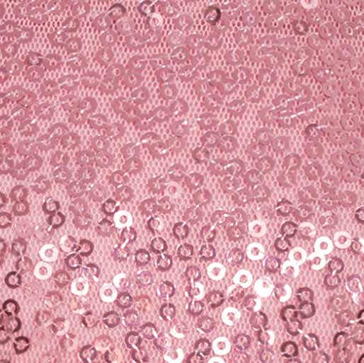 Close-up of pink sequin fabric showing glittery texture from a sparkly dog dress.