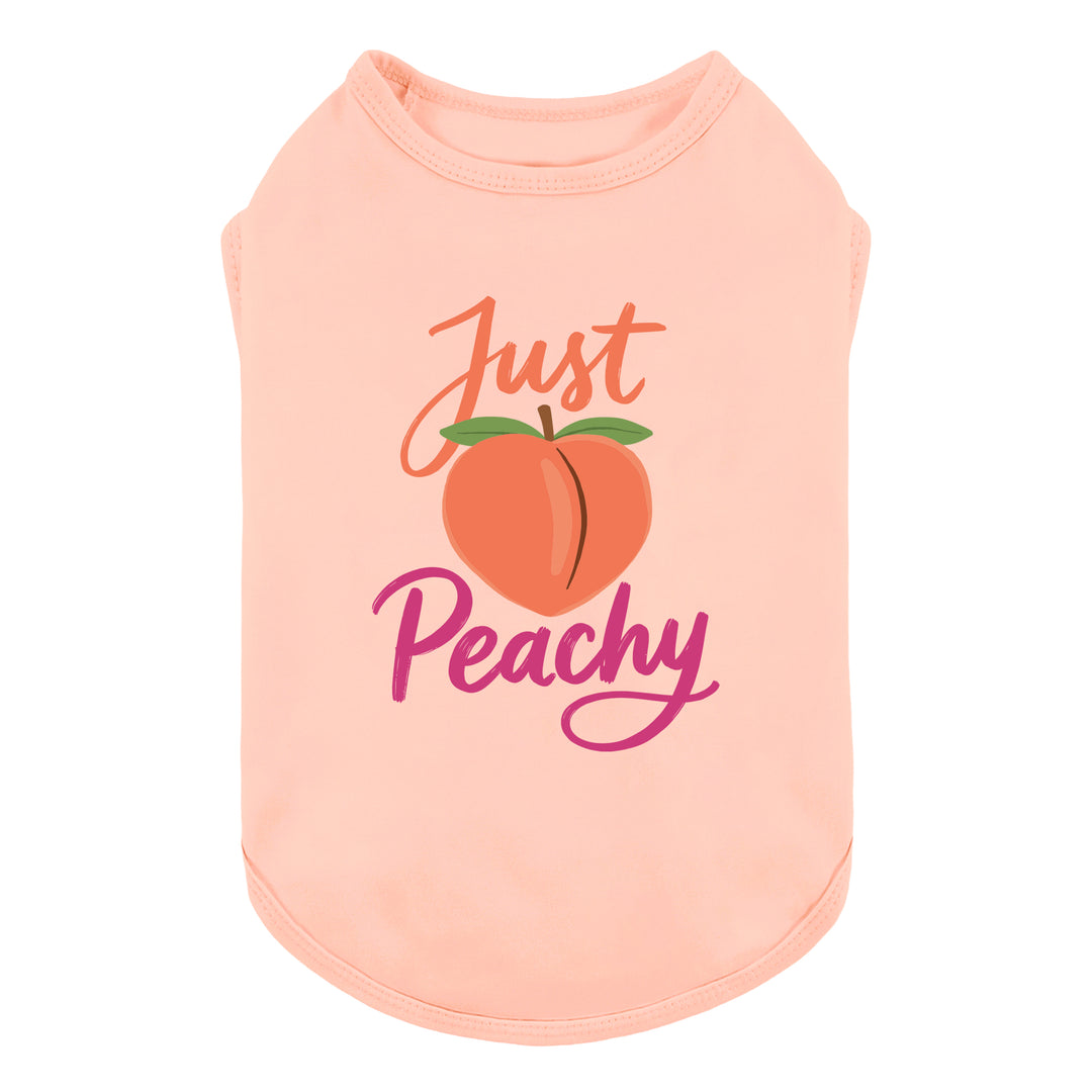 Peach-colored dog shirt with 'Just Peachy' lettering and peach graphic on a white background