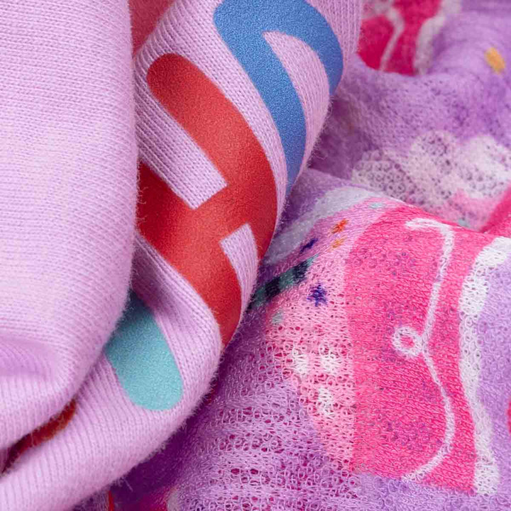 Close-up of colorful fabric with patterns and text