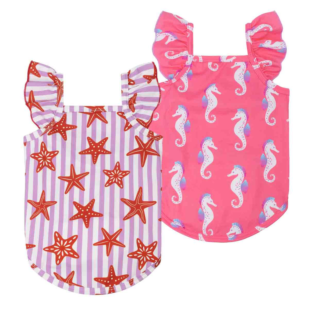 Two dog summer shirts with starfish and seahorse patterns on a white background
