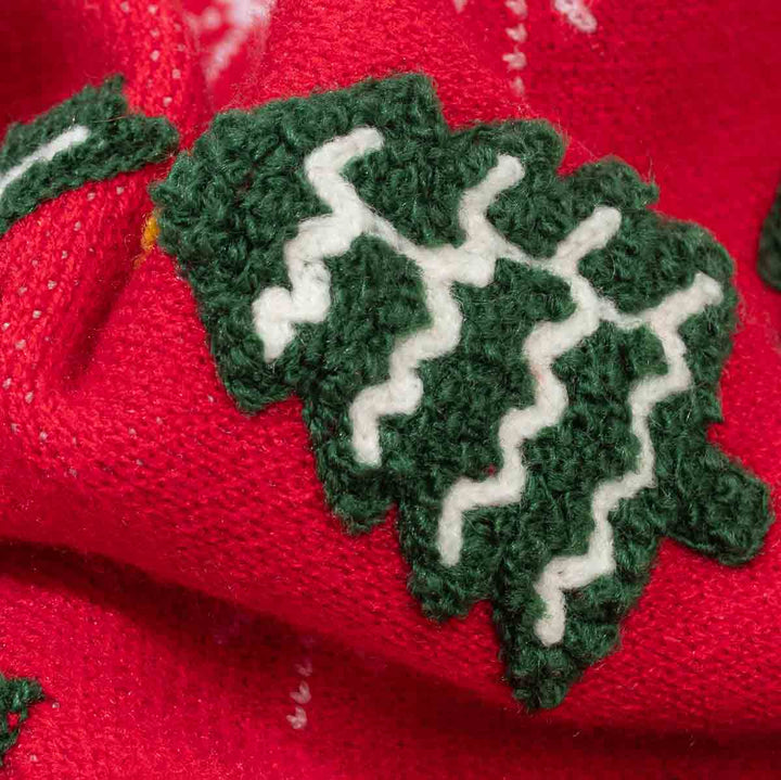 Close up of cozy fabric of dog knit sweater with cute Christmas tree print