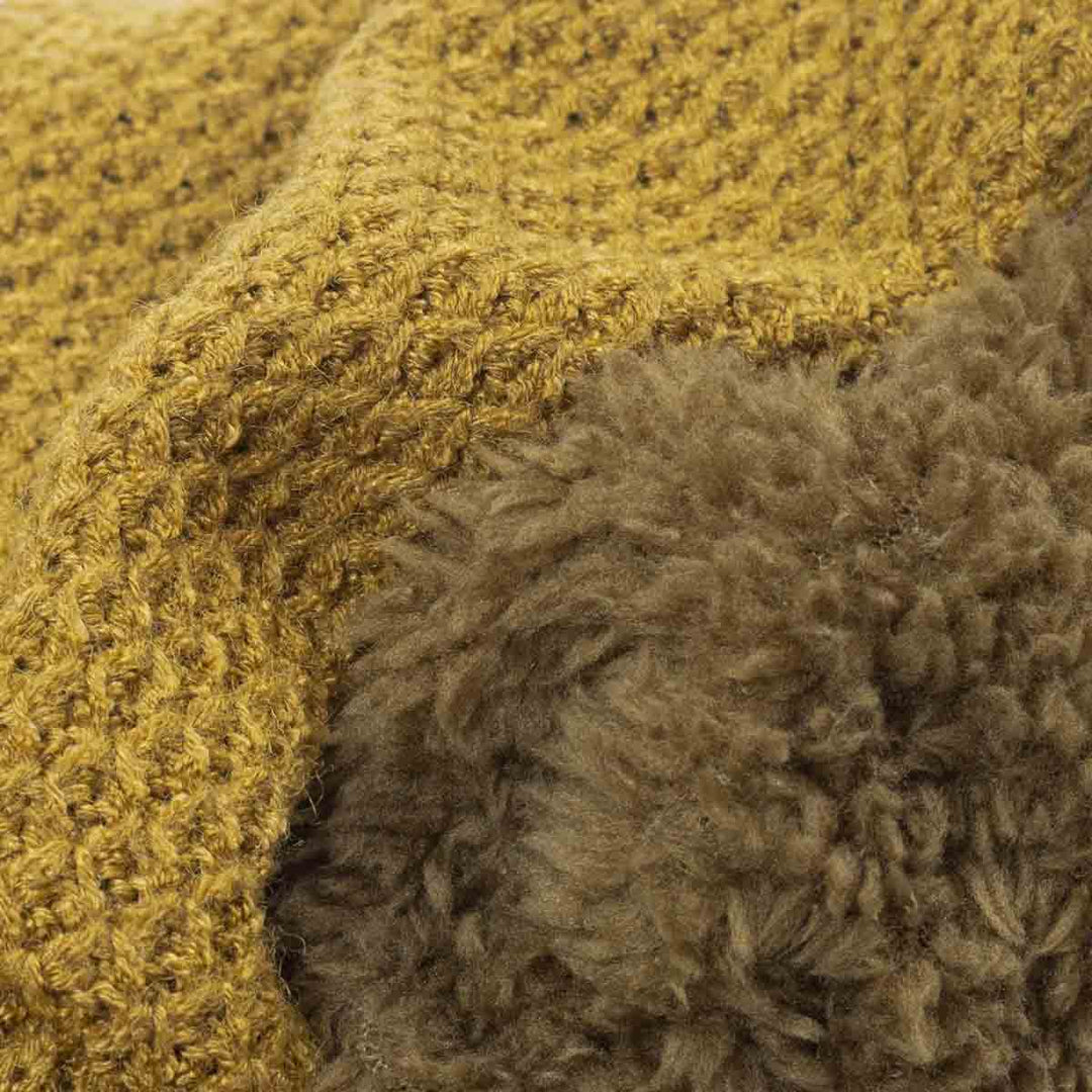 Close up of fuzzy knitted dog onesie 