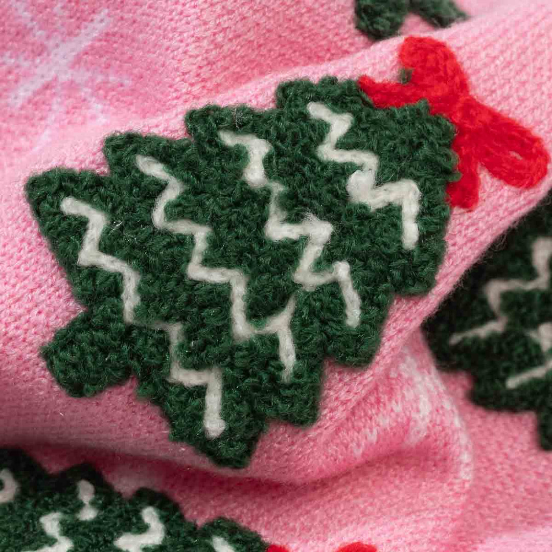 Soft fabric of festive sweater for dogs with a Christmas tree and a bow on it