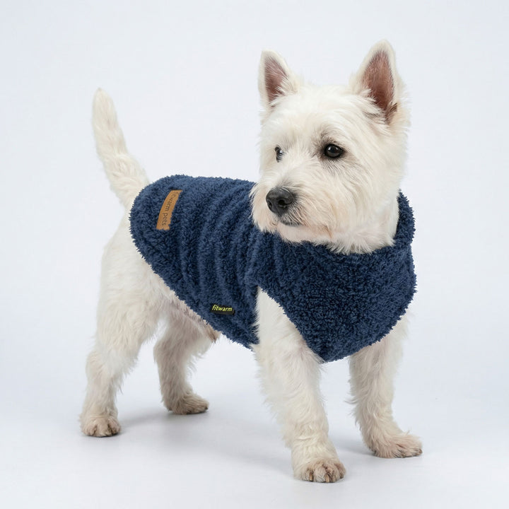 Westie wearing a cozy fluffy dog sweater, specially designed for winter