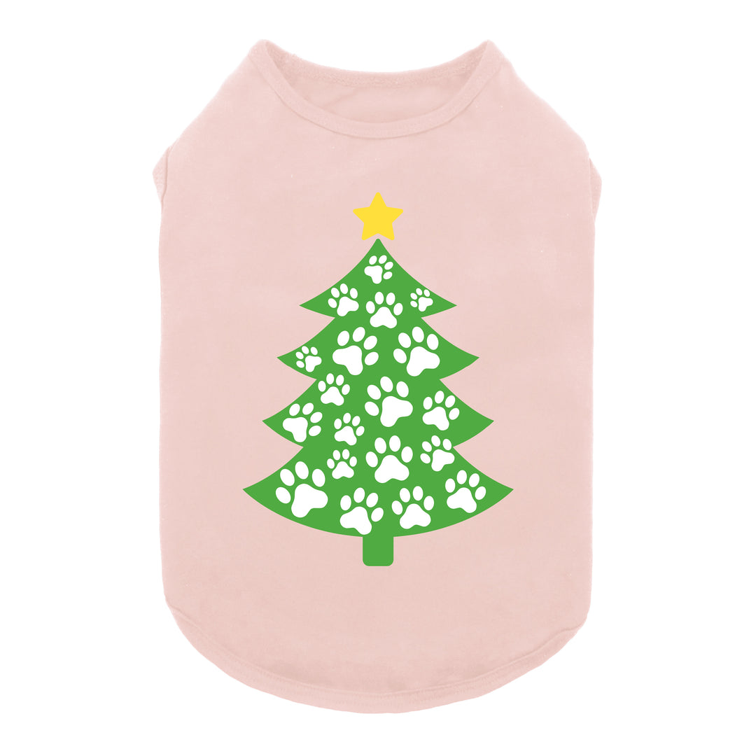 Pink dog shirt featuring a green Christmas tree design made of white paw prints with a yellow star on top.