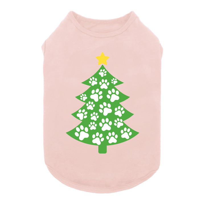 Pink dog shirt featuring a green Christmas tree design made of white paw prints with a yellow star on top.
