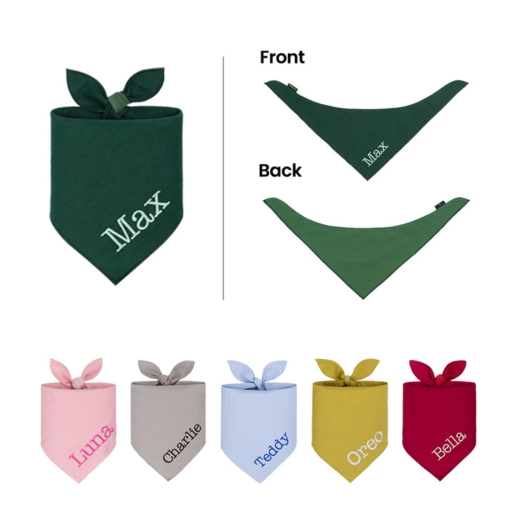 Collection of colorful bandanas for dogs with embroidered names on a white background