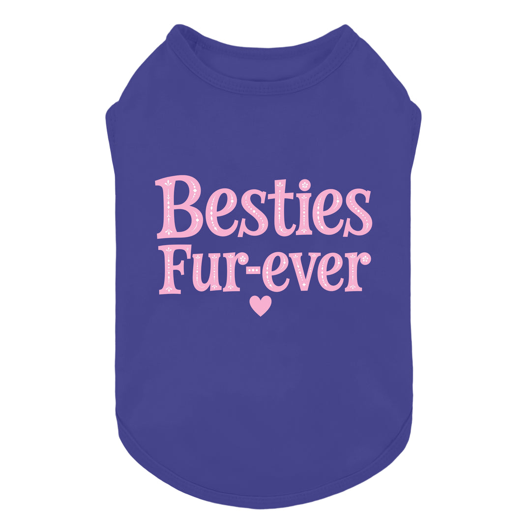 Purple sleeveless shirt for dogs with lettering 'Besties Fur-ever' printed in pink across the front, accompanied by a small pink heart below the text, shown on a plain white background