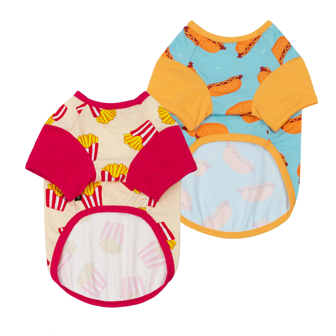 Two colorful dog t shirts with different prints on a white background