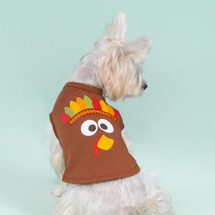 White fluffy dog dressed in brown turkey Thanksgiving dog tank top