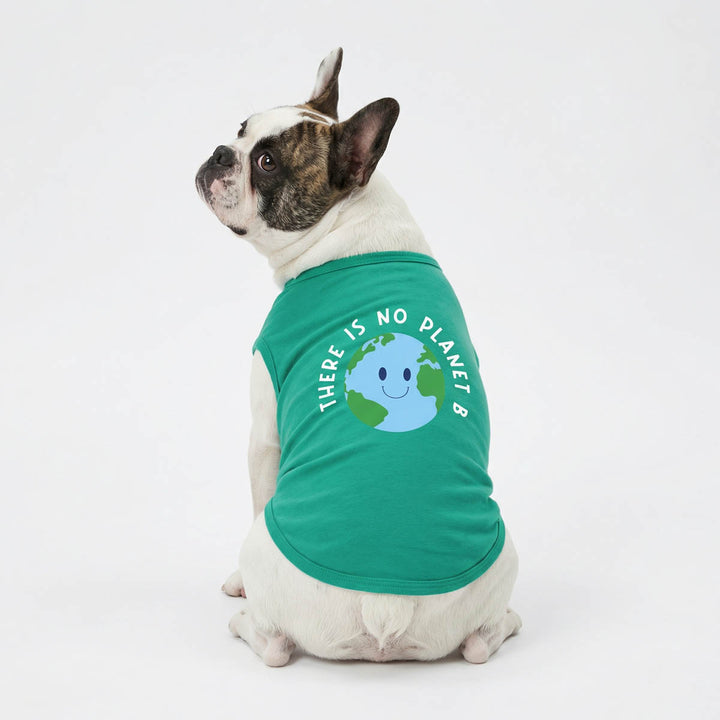 French Bulldog wearing a green dog shirt with eco-friendly lettering and the earth print