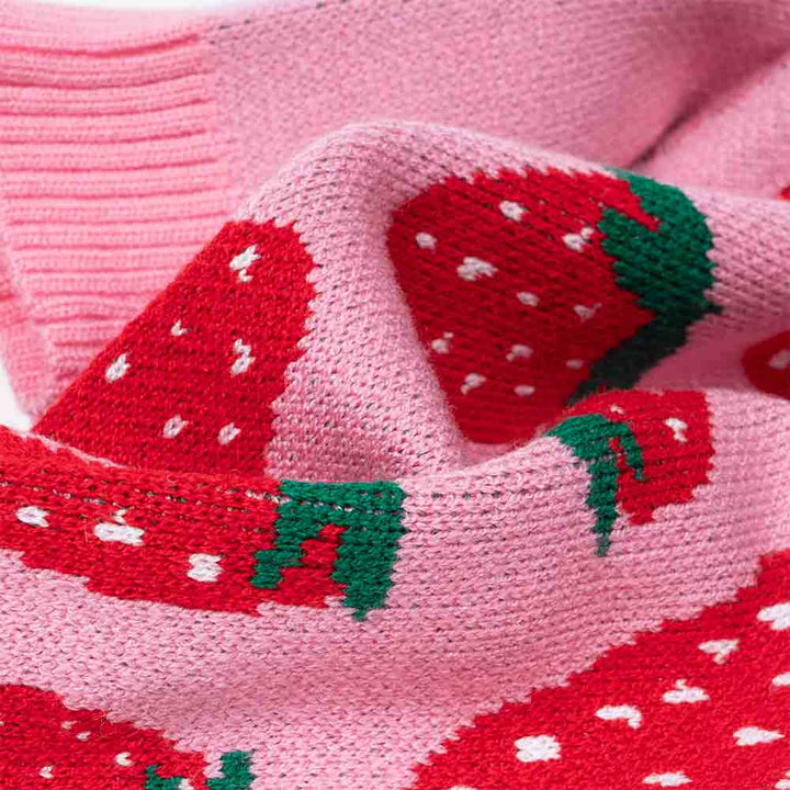 Knitted strawberry-print dog sweater in soft pink, ideal for small breeds.