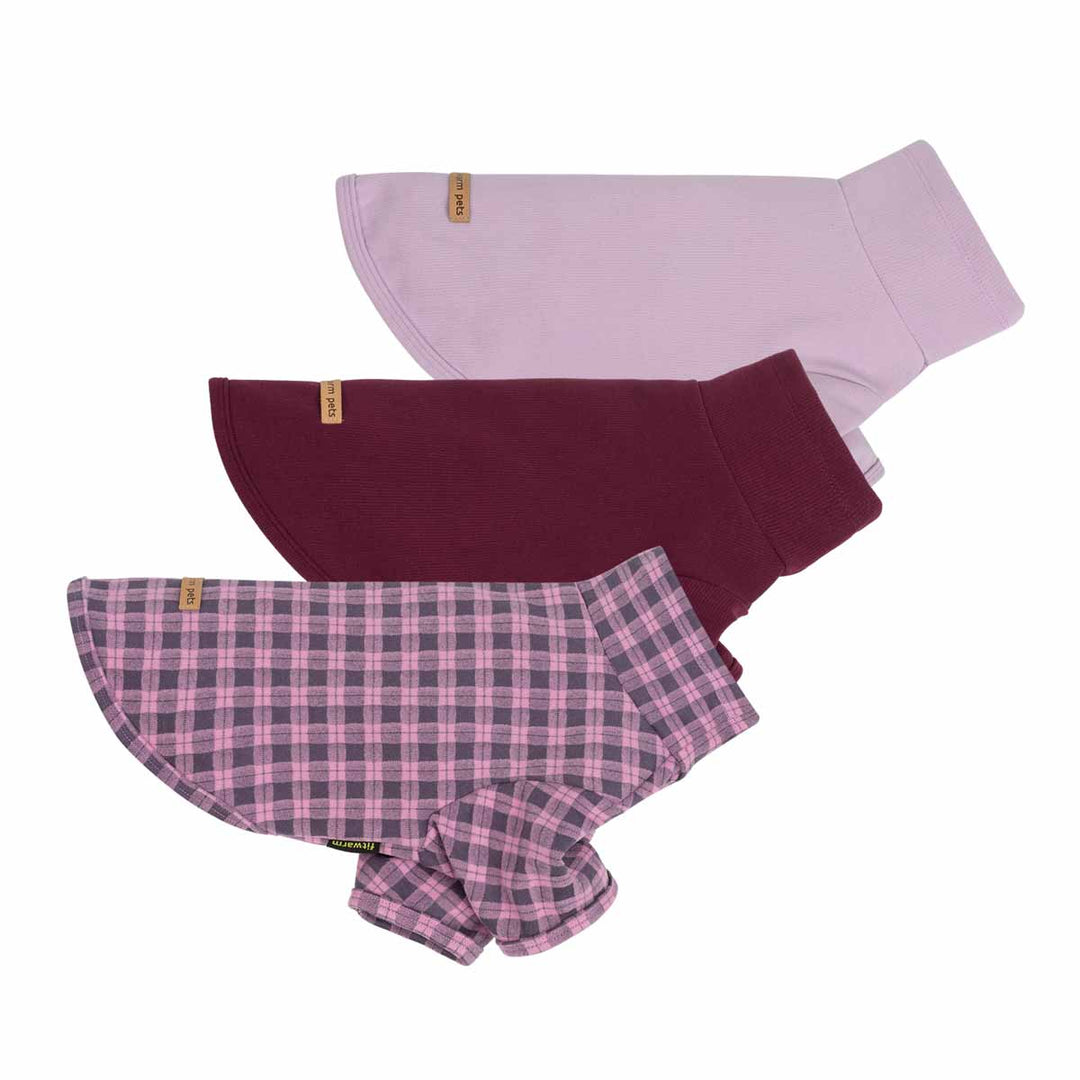 Three dog fleece sweaters in different colors and patterns are displayed on a solid white background