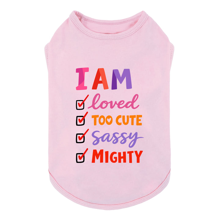 Pink dog shirt featuring “I AM loved too cute sassy mighty” lettering with colorful checklist design.