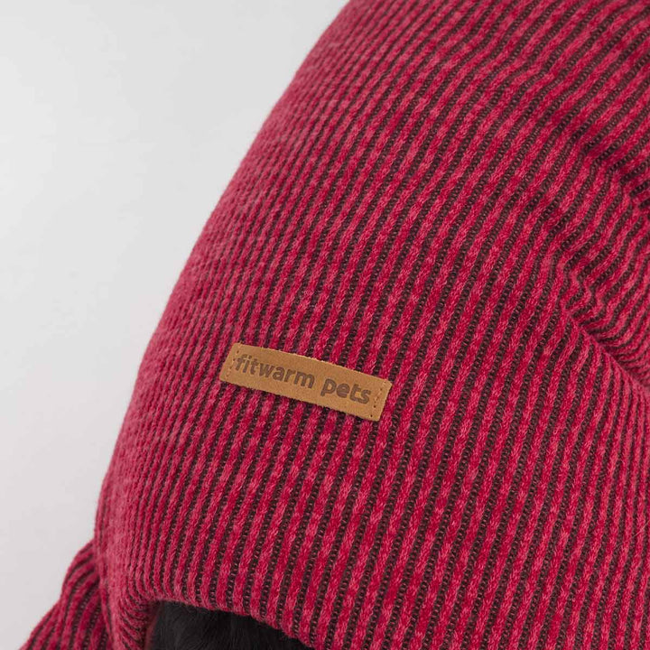 Close-up of red striped dog coat with Fitwarm leather label