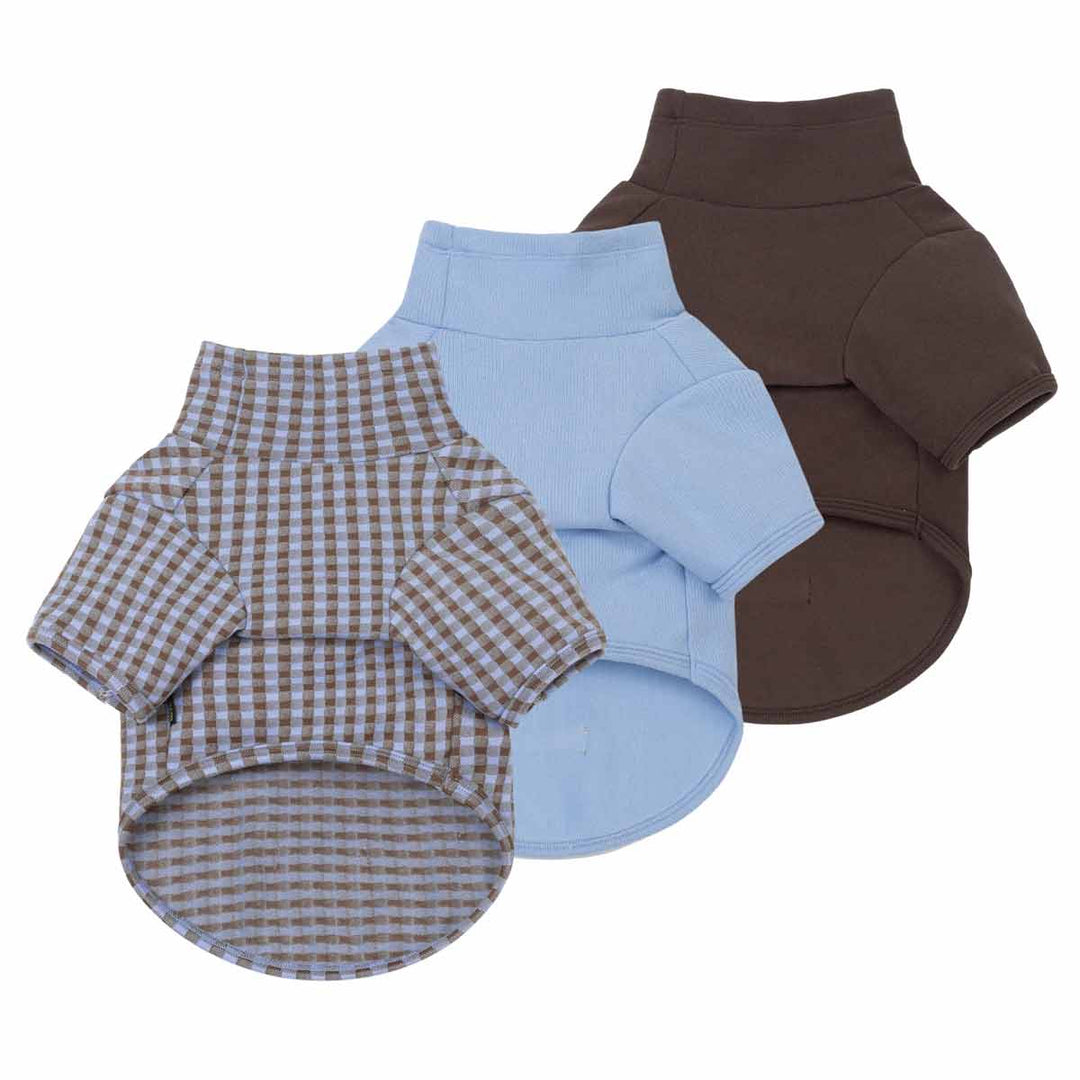 Three small sweater for dogs shown on a plain white background: one brown-and-beige gingham, one light blue, and one dark brown solid