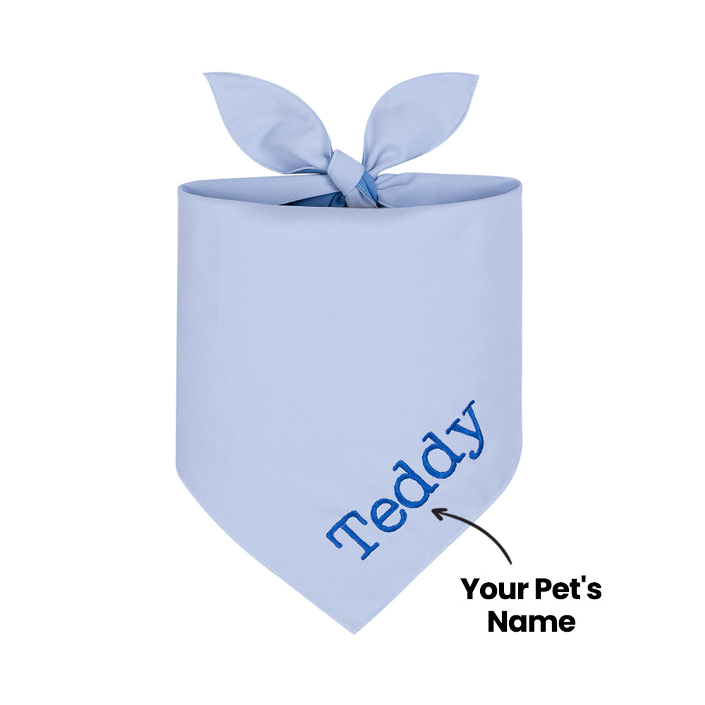Blue dog bandana with 'Teddy' embroidered on it, ready to be personalized with a pet's name.
