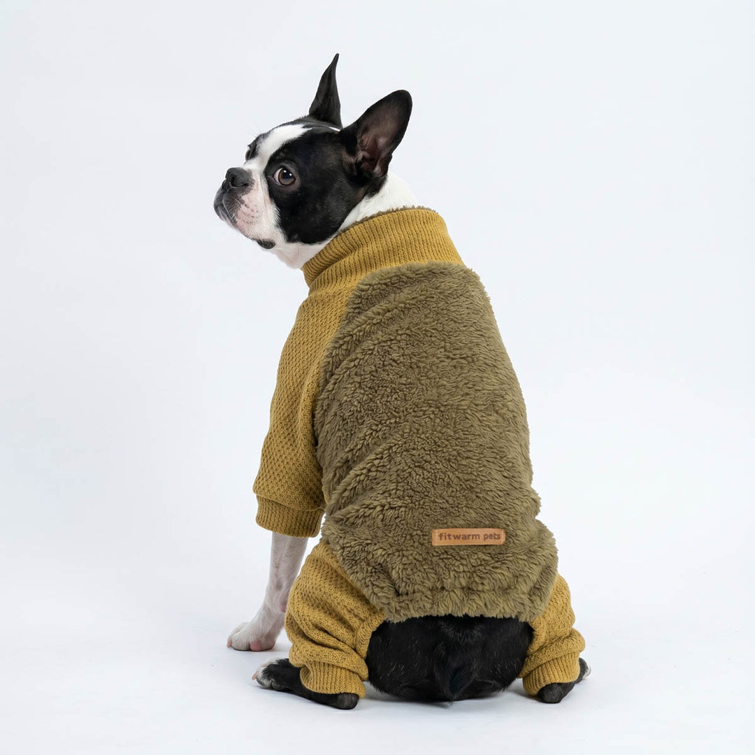Boston Terrier wearing an olive dog fleece onesie, photographed from the back against a clean white studio background.