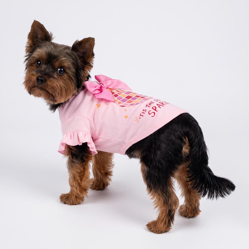 Yorkie standing on a white background with ruffle dog tshirt in bow and disco ball print
