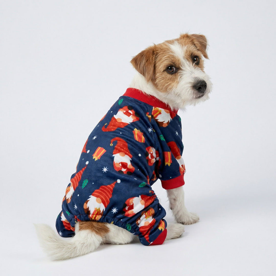 Rear view of dog in soft dog onesie decorated with Christmas themed prints