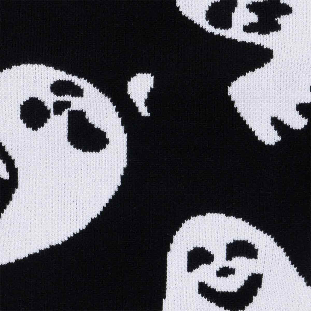 Soft black knit ghost dog sweater fabric detail, featuring white spooky and smiling ghost patterns for Halloween fun.