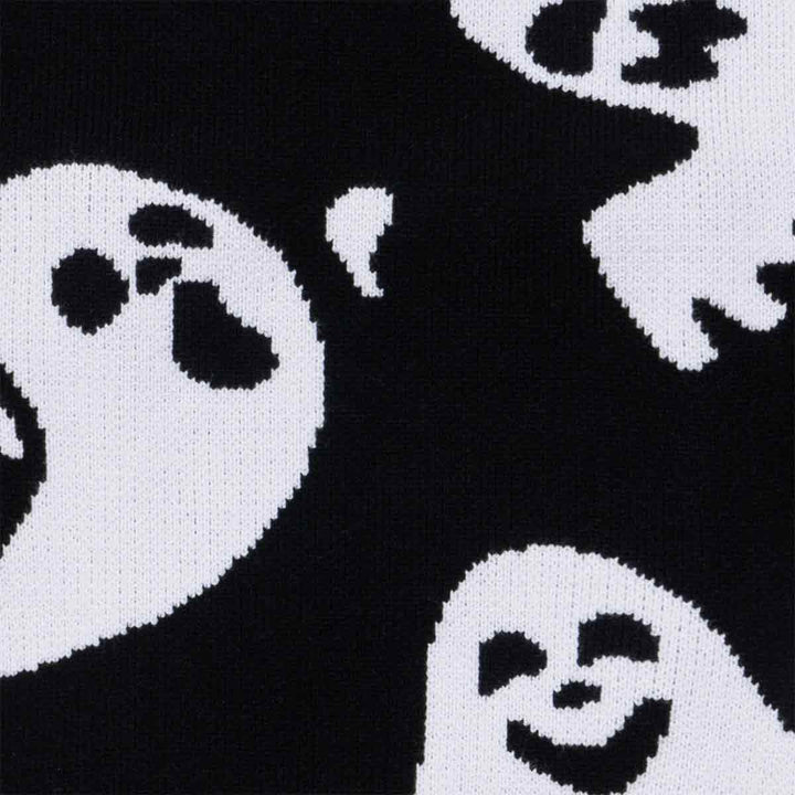 Soft black knit ghost dog sweater fabric detail, featuring white spooky and smiling ghost patterns for Halloween fun.