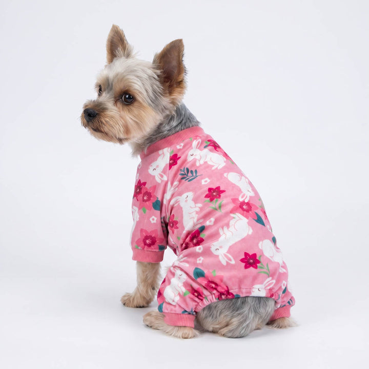 Back view of Yorkie wearing a pink dog pjs with a flower and rabbit pirnts