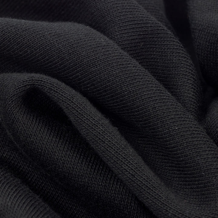 Close up of soft fabric texture on black dog hoodie made for dogs