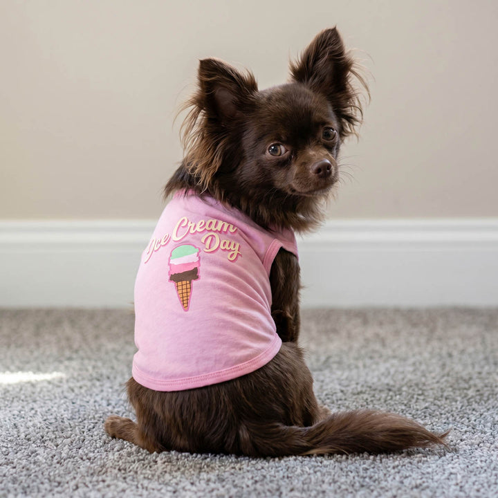 Back view of a Chihuahua wearing a pink dog tank top with 'ice cream day' lettering and colorful ice cream print