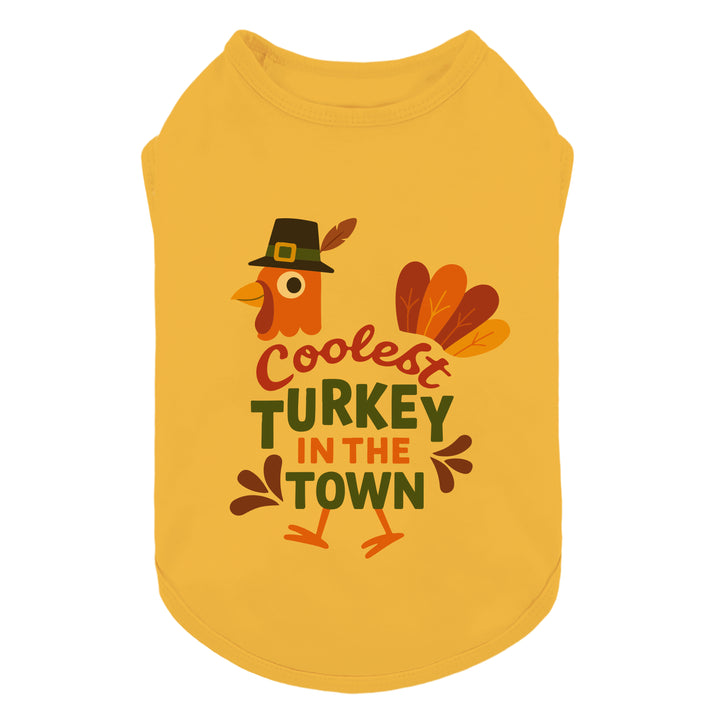 Thanksgiving dog shirt in yellow with bold “Cutest Turkey in the Town” lettering on the back.
