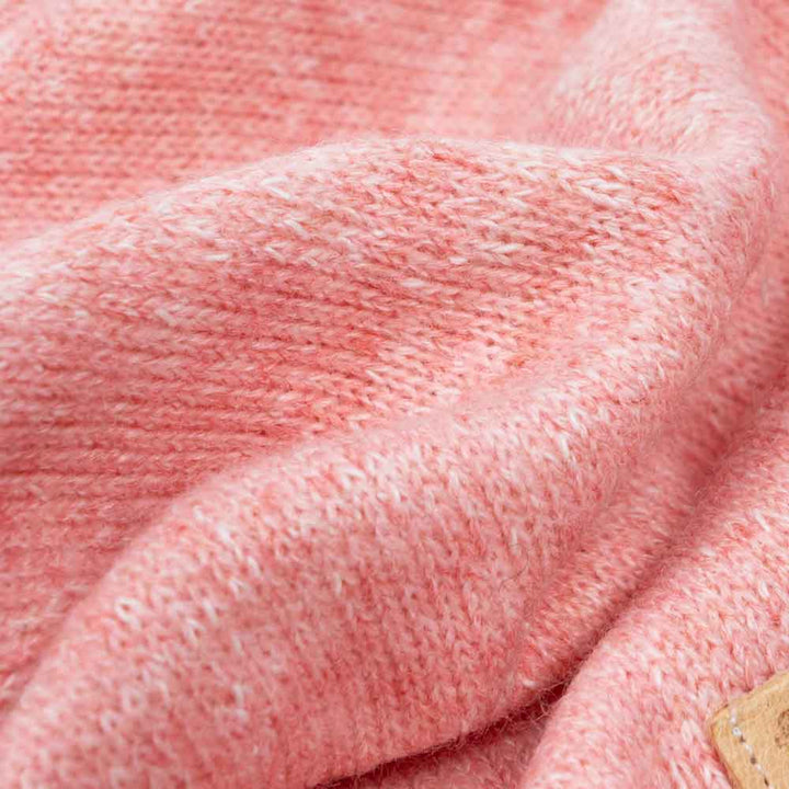 Close-up of speckled rose pink heathered knit fabric for dog hoodies, showcasing soft texture and material blend.
