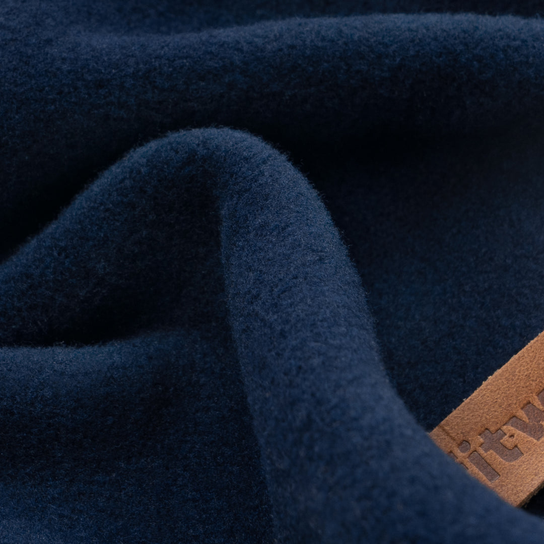 Dog hoodie in deep blue with beige details, ideal for cool weather comfort.