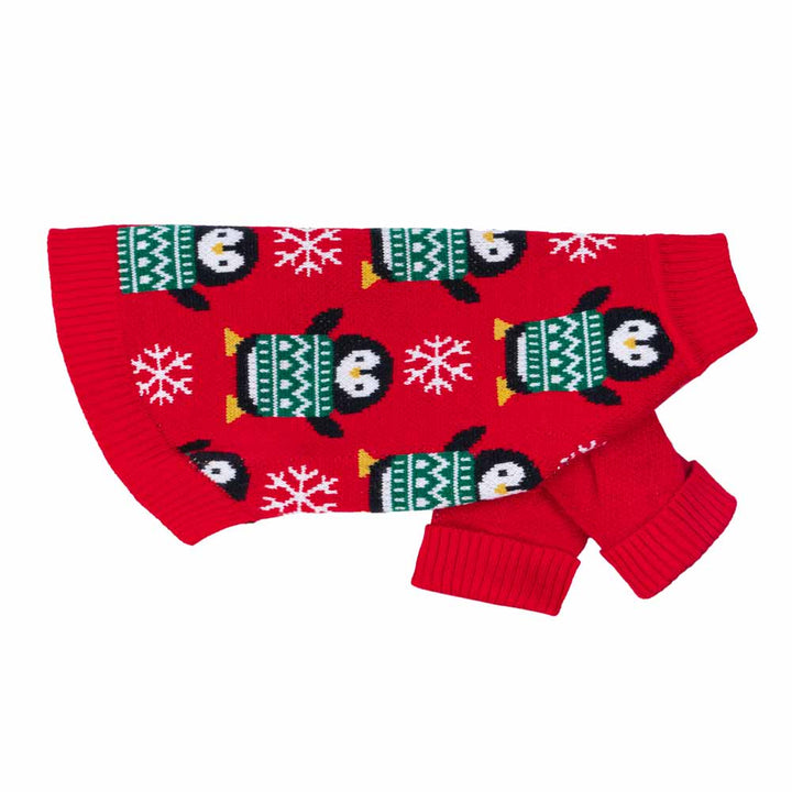 Side view of red holiday dog sweater with penguins and snowflakes knitted in.