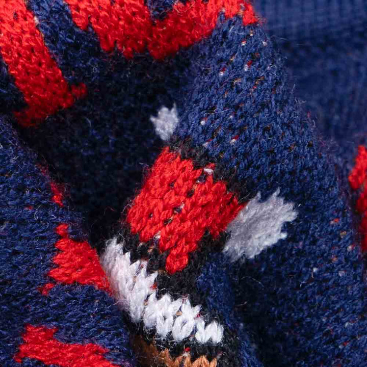 Navy blue dog sweater with festive Fair Isle pattern featuring red moose, white snowflakes, and Christmas trees.
