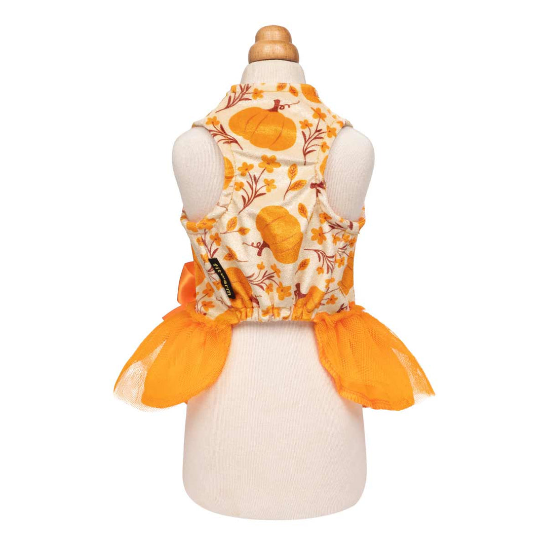 Festive dog dress featuring pumpkins, flowers, and a bright tulle skirt with a satin bow.