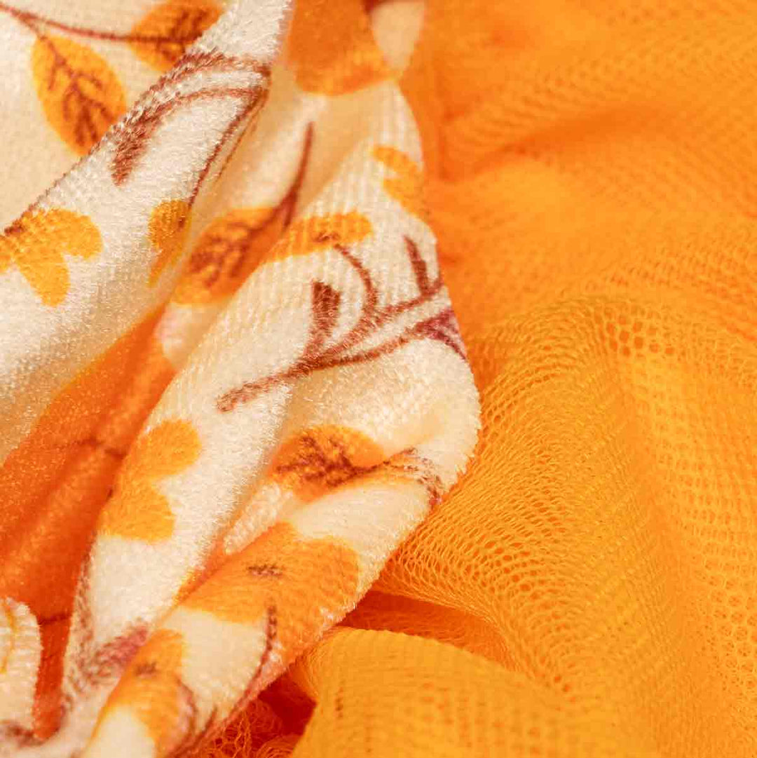 Textured dog dress featuring velvet floral prints and a layered tulle skirt in autumn hues.